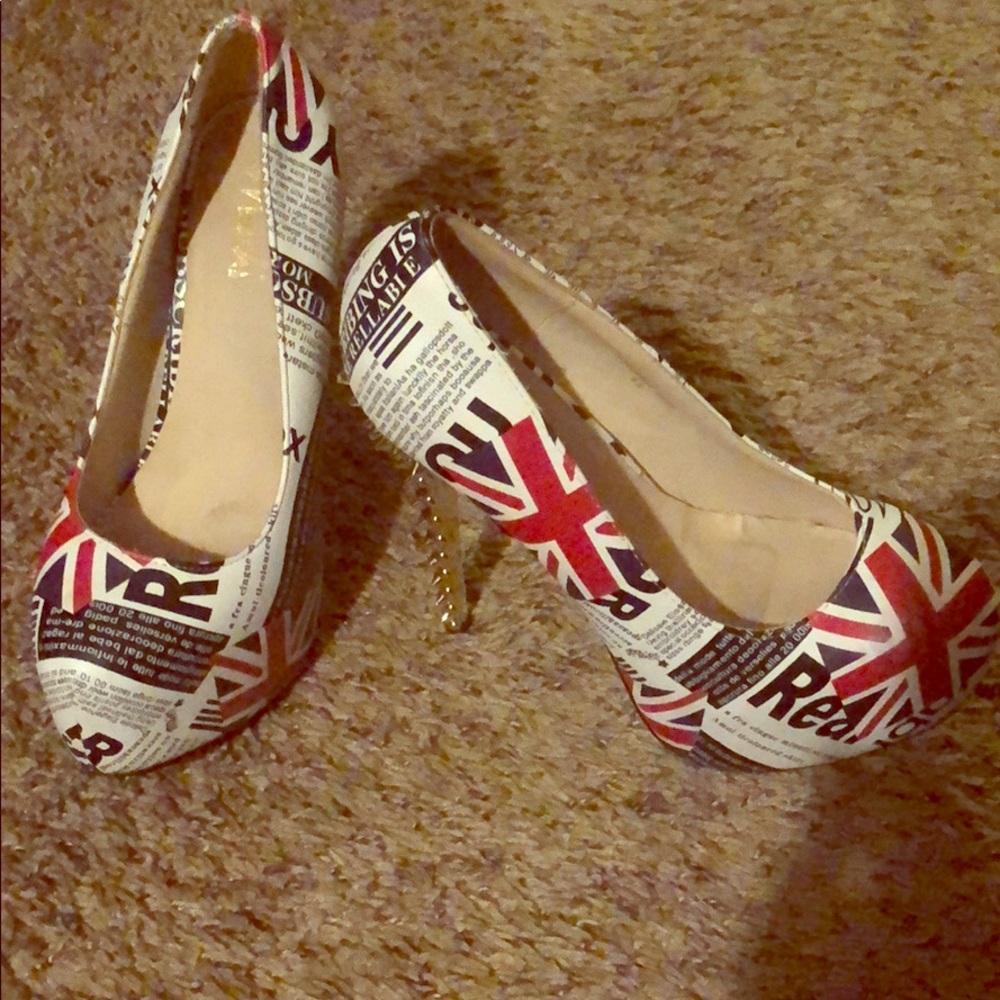 Barely worn red white and blue heels .